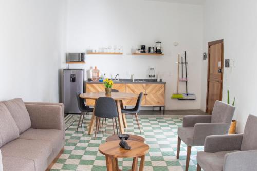 a living room with a couch and a table at Casa Monarcas - Victoria (with AC) in Guadalajara