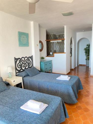 Postel nebo postele na pokoji v ubytování Zodiac Apartments