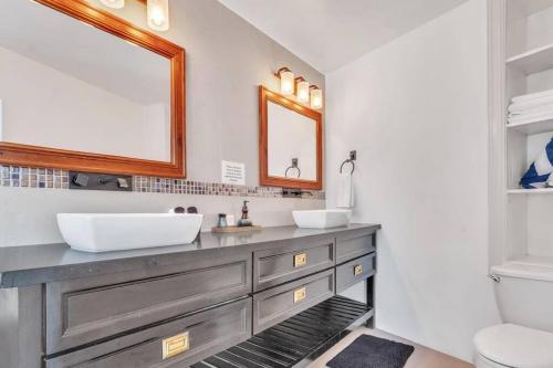 a bathroom with a sink and a mirror at Mosaic luxury Villa in Hopewell