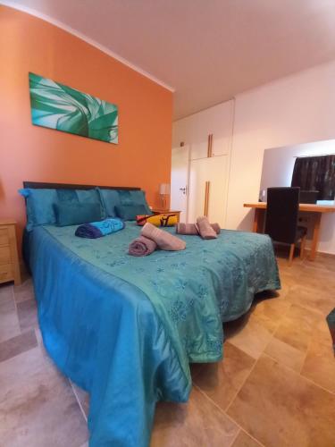 a bedroom with a bed with two pillows on it at Villa Danae in Makry Gialos
