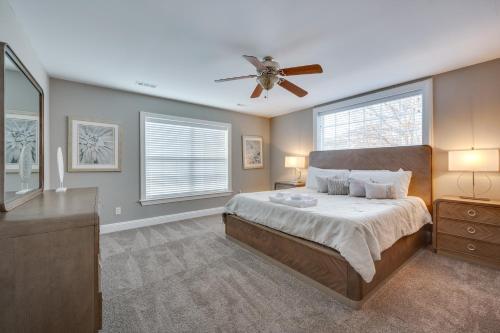 a bedroom with a bed and a ceiling fan at Spacious Mooresville Home with Lake Norman View! in Mooresville