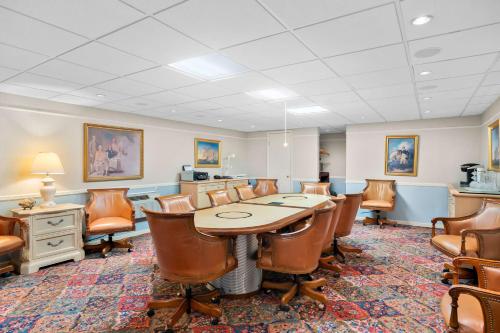 a conference room with a table and chairs at Brandywine Valley Inn SureStay Plus by Best Western in Wilmington
