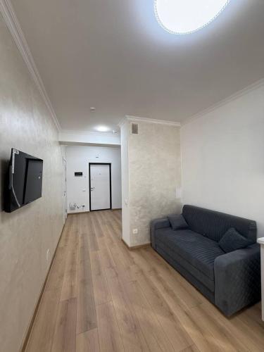 TV a/nebo společenská místnost v ubytování Inam Apart