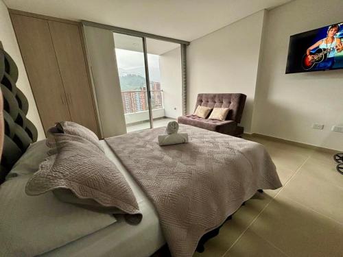 Ένα ή περισσότερα κρεβάτια σε δωμάτιο στο Moderno Apartamento en Sabaneta cerca al parque