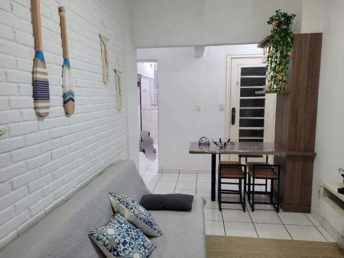 a living room with a couch and a table at Apart511 in Santos