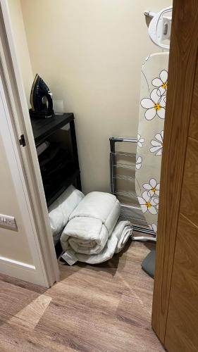 a room with a pile of pillows on the floor at Abbey House in Horsham