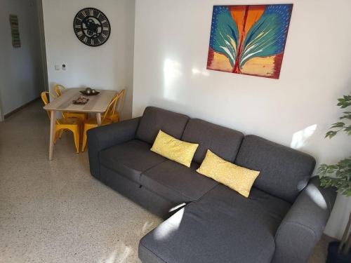a living room with a couch and a table at Motril - Poniente Beach in Motril