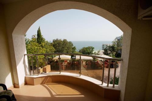 an archway in a building with a view of a patio at Aqua View SPA Boutique Hotel in Golden Sands