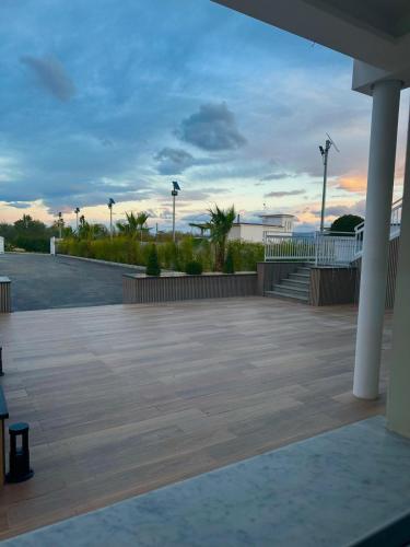 a view of a parking lot with the ocean in the background at Luxury Rooms in Somma Vesuviana