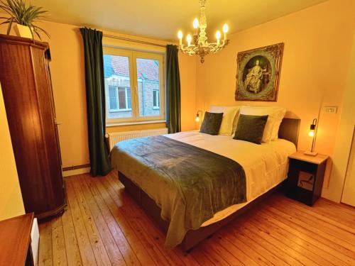 Ένα ή περισσότερα κρεβάτια σε δωμάτιο στο Acadia by De Drie Koningen