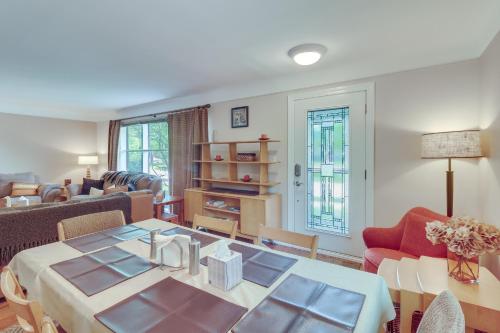 a living room with a table and chairs and a couch at Royal Oak Home 13 Mi to Downtown Detroit in Royal Oak