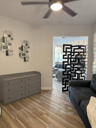 a living room with a couch and a painting on the wall at Gotravel in Cut and Shoot