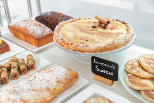 a display of different types of bread and pastries at Iria Beach Art Hotel in Agia Anna Naxos
