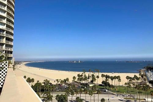 a view of a beach and the ocean from a building at 2 Bed Ocean View Balconys Corner Unit LB Convention Center in Long Beach