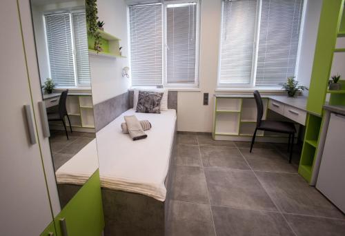 a small office with a couch in the middle of a room at DORM BG pet-friendly Aparthotel in Stara Zagora