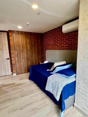 Postel nebo postele na pokoji v ubytování Apartamentos en Laureles Medellin con Aire Acondicionado