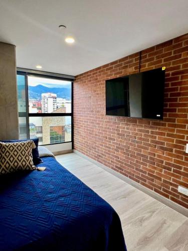 TV a/nebo společenská místnost v ubytování Apartamentos en Laureles Medellin con Aire Acondicionado