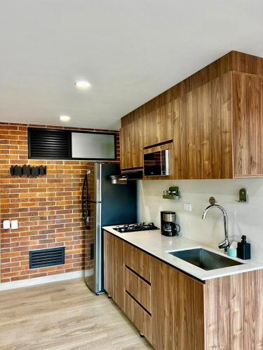 Kuchyň nebo kuchyňský kout v ubytování Apartamentos en Laureles Medellin con Aire Acondicionado
