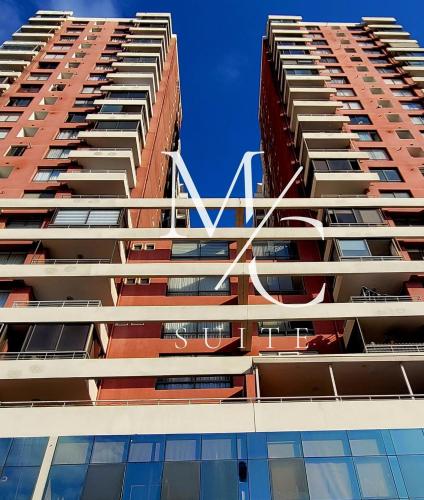 two tall buildings with the letter k on them at Disponible Exclusivo Depto Central. Clinica Antofagasta. Wi-Fi Parking y Factura in Antofagasta