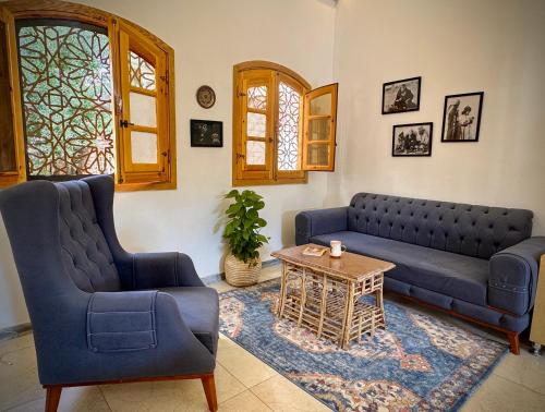 a living room with a couch and a table at Dar Lina Guesthouse Luxor in Luxor