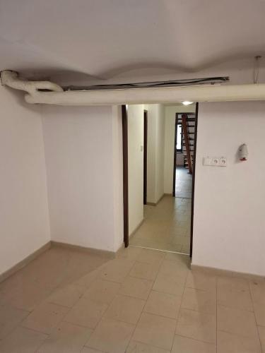 an empty room with a ceiling and a tile floor at Sluneční villa Terezka Lednice ,penzion pro skupiny se snídaní,degustací vín in Lednice