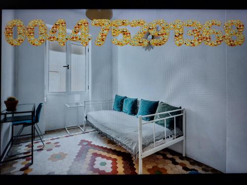 a bedroom with a crib in a room with a chandelier at Golden Moor accommodation in Tamworth