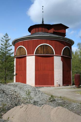 a red and white building with a black top at STF Sala Silvergruva Vandrarhem in Sala