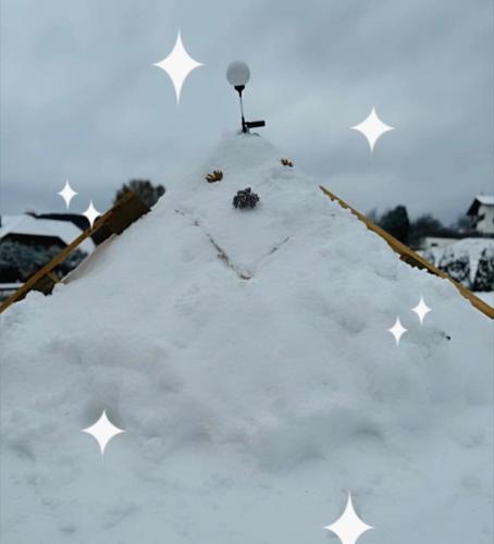 a pile of snow with stars on top of it at Ferienhaus in Unterdeka