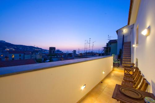 a balcony with stairs and a view of a city at Sorrento Belvedere B&B in Sorrento