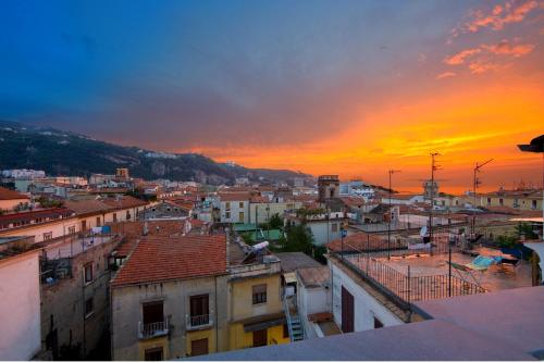 a view of a city at sunset at Sorrento Belvedere B&B in Sorrento