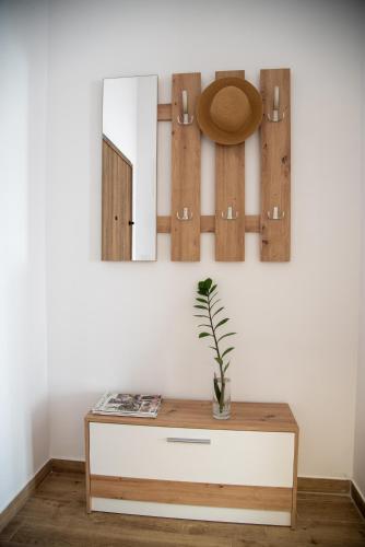 a room with a dresser and a mirror at Konstantins Apartment in Ohrid