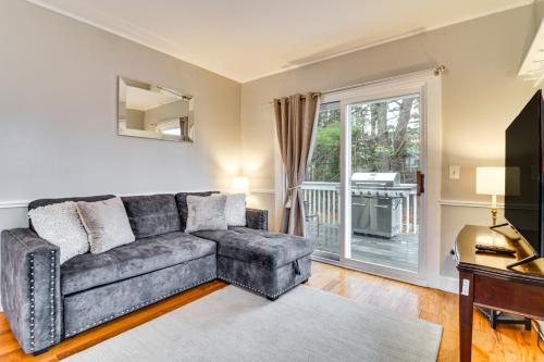a living room with a couch and a window at Ski, Hike and Fish Dog-Friendly Gem in Conway in North Conway