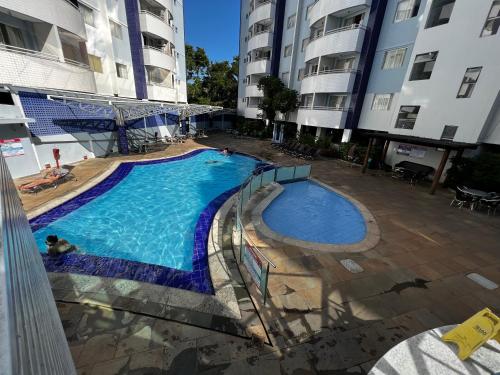 an overhead view of a swimming pool in a building at Águas da Serra - Apto 2qts in Rio Quente