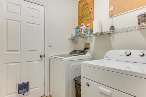 a white laundry room with a washer and dryer at 11 Mi to Sand Hollow State Park Home with Fire Pits in Hurricane