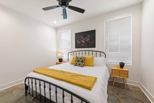 a bedroom with a bed and a ceiling fan at Teche House KING Bed Luxury Getaway Fast WiFi in Lafayette