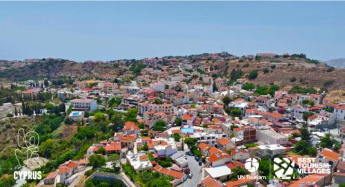an aerial view of a city with houses and trees at Gorgeous SeaView house in Pissouri