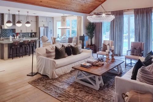 a living room with a white couch and a table at The Rookery in Blackbanks