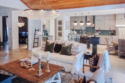 a living room with a white couch and a table at The Rookery in Blackbanks