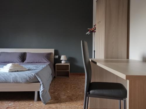 Ένα ή περισσότερα κρεβάτια σε δωμάτιο στο Casa vacanze da zio Ennio - Sulcis, Sud Sardegna