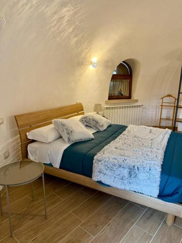 a bedroom with a bed and a chair at Miele B&B in Vinchiaturo