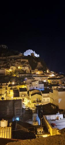 a group of buildings on a hill at night at Villa Giummarito in Scicli