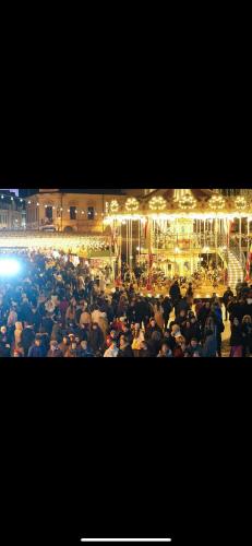 a large group of people standing in a crowd at Stadium Central Apartment Residence & terrace in Craiova