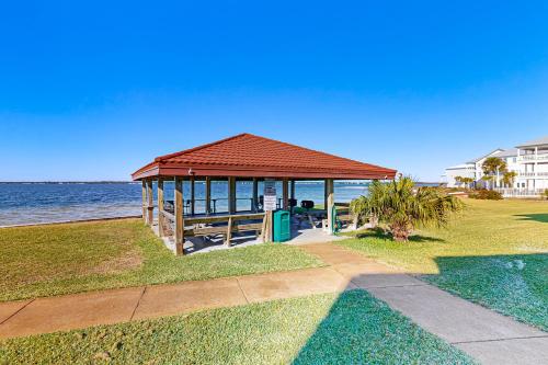a gazebo on the grass near the water at Sunset Harbor Palms 1-308 in Navarre