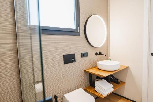 a bathroom with a sink and a mirror at Casa Cuatro Boutique Hotel - Adults Recommended in Novo Sancti Petri
