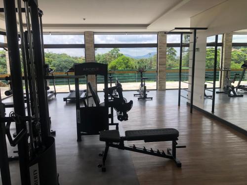 a gym with treadmills and machines in a room at Quinta de Santa Barbara Eco Resort in Pirenópolis