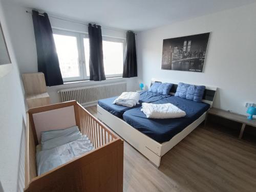 Postel nebo postele na pokoji v ubytování Ferienwohnung Nordsee mit E-Bike Verleih