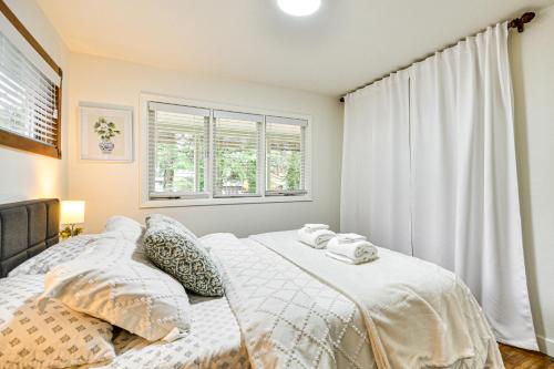 a bedroom with a bed and a window at Modern Home with Spacious Yard in Beaverton! in Beaverton