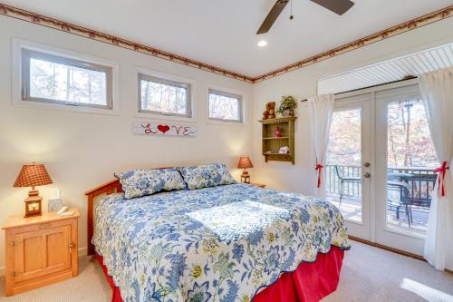 a bedroom with a bed and a window at Waterfront Lake Anna Home Kayaks and Private Dock in Mineral