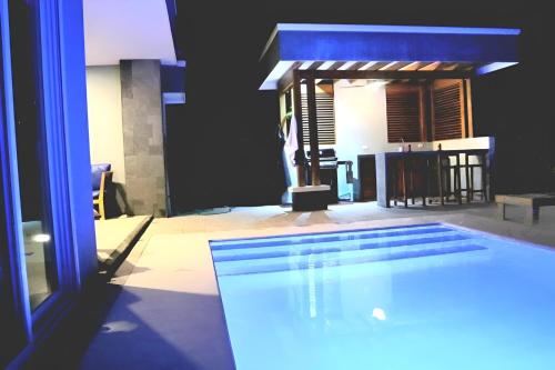 a view of a swimming pool in a house at Tranquil Tides Costa Rica in Pochote