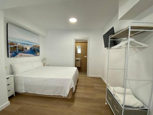 En eller flere senge i et værelse på Playa y Sol z1